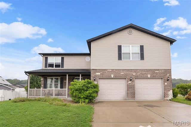 806 Erika Leigh Ct, Caseyville, IL 62232 - traditional-style home with brick siding, a porch, driveway, and a garage