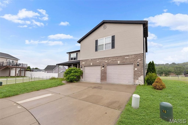 806 Erika Leigh Ct, Caseyville, IL 62232 - view of property exterior with an attached garage, brick siding, and concrete driveway