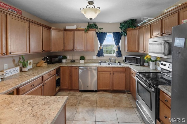 806 Erika Leigh Ct, Caseyville, IL 62232 - kitchen with stainless steel appliances, light countertops, and brown cabinetry