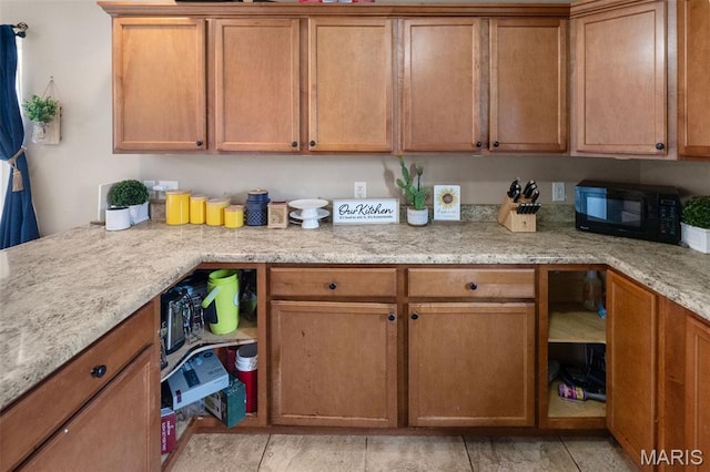 806 Erika Leigh Ct, Caseyville, IL 62232 - kitchen with black microwave, brown cabinets, and light stone counters