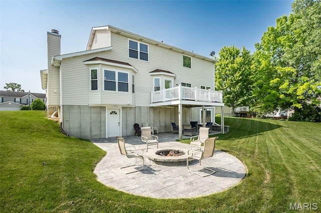 5 Poor Richard Ct, Ofallon, MO 63366 - back of property with a patio, a fire pit, a yard, and a chimney