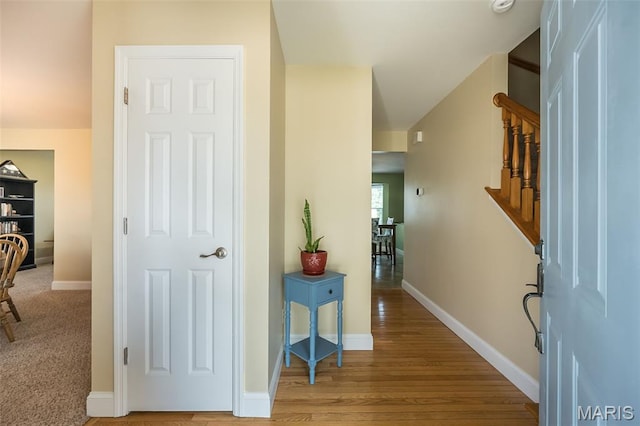5 Poor Richard Ct, Ofallon, MO 63366 - hallway with stairs and wood finished floors
