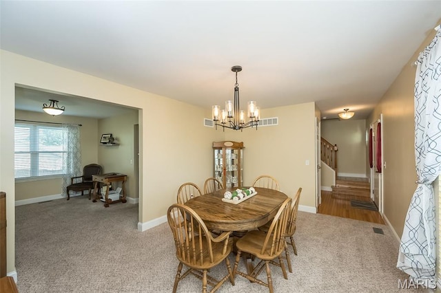 5 Poor Richard Ct, Ofallon, MO 63366 - carpeted dining space featuring a chandelier, stairway, and an office area