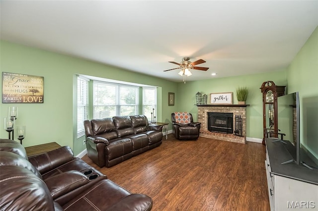5 Poor Richard Ct, Ofallon, MO 63366 - living room with dark wood-style flooring, a ceiling fan, and a fireplace