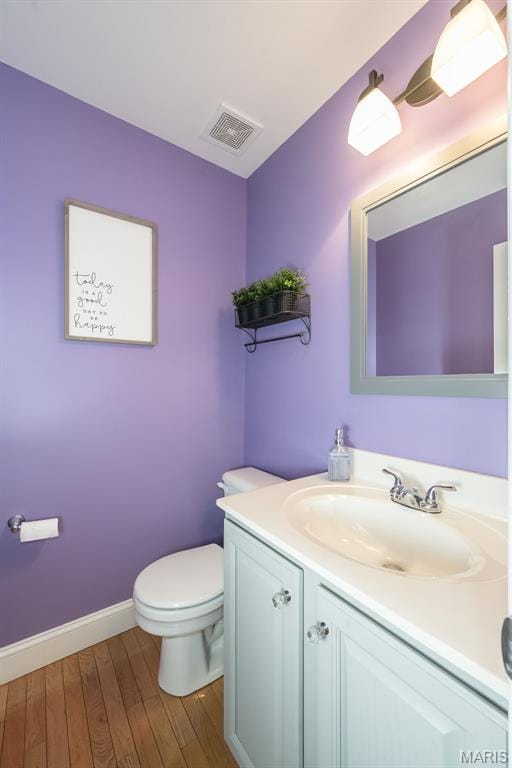 5 Poor Richard Ct, Ofallon, MO 63366 - half bath featuring vanity and wood finished floors