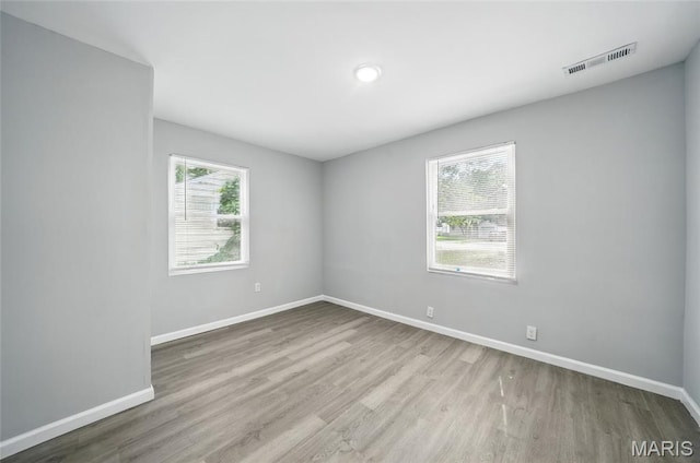 260 S Hartnett Ave, Saint Louis, MO 63135 - empty room with wood finished floors and baseboards