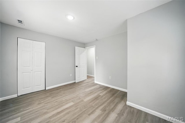 260 S Hartnett Ave, Saint Louis, MO 63135 - unfurnished bedroom with a closet and wood finished floors