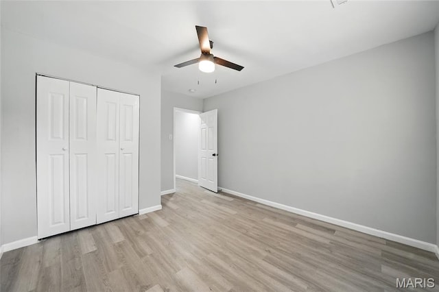 260 S Hartnett Ave, Saint Louis, MO 63135 - unfurnished bedroom with light wood finished floors, a closet, and a ceiling fan