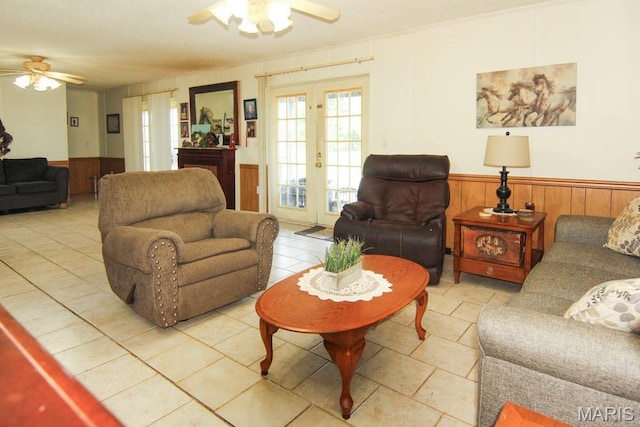 17748 State Highway C, Advance, MO 63730 - living area with ceiling fan, wainscoting, french doors, light tile patterned flooring, and wooden walls