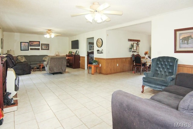 17748 State Highway C, Advance, MO 63730 - living room with wainscoting, a ceiling fan, wood walls, and light tile patterned flooring