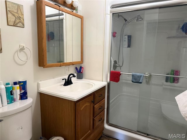 111 N Levering Ave, Hannibal, MO 63401 - bathroom with a stall shower, vanity, and toilet