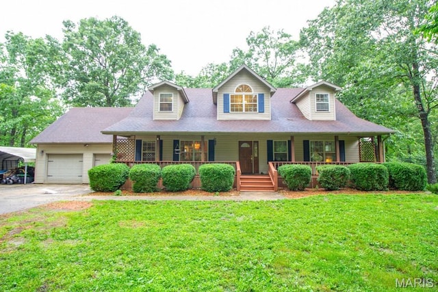 25350 Englewood Ln, Lebanon, MO 65536 - new england style home with a front yard, covered porch, driveway, and a garage