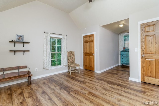 25350 Englewood Ln, Lebanon, MO 65536 - living area featuring lofted ceiling, wood finished floors, baseboards, and ceiling fan