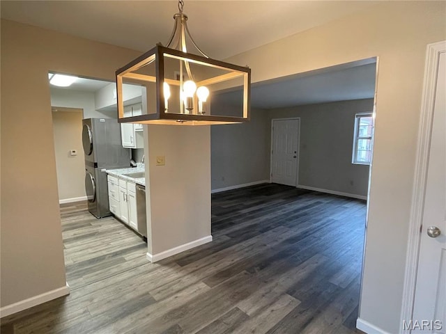 9158 Eager Rd, Brentwood, MO 63144 - kitchen with white cabinetry, dark wood-style flooring, light countertops, and decorative light fixtures
