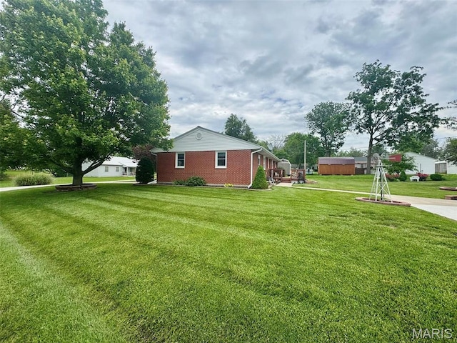 115 Park St, Monroe City, MO 63456 - view of green lawn with a storage unit