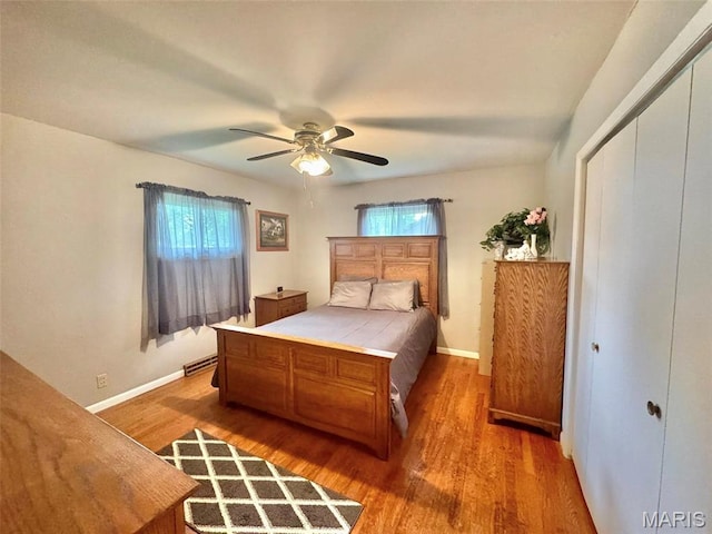 115 Park St, Monroe City, MO 63456 - bedroom featuring multiple windows, wood finished floors, and baseboards