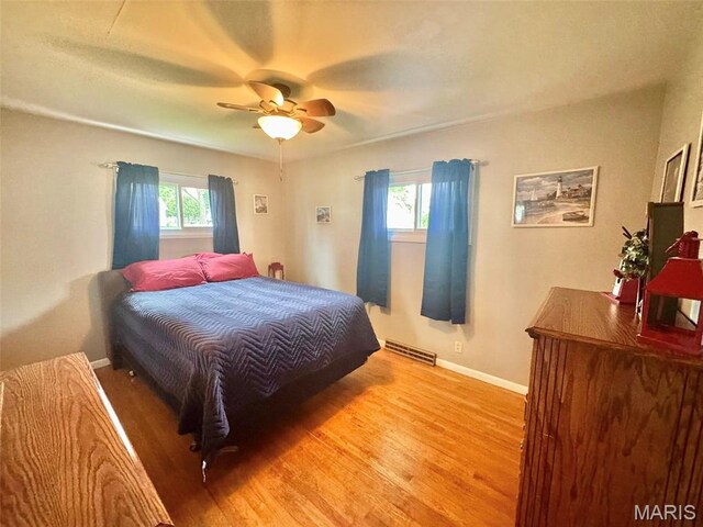 115 Park St, Monroe City, MO 63456 - bedroom featuring wood finished floors, baseboards, and a ceiling fan