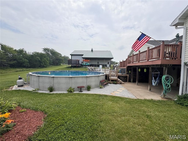 3581 Eagle Crest Dr, Palmyra, MO 63461 - swimming pool featuring a wooden deck, a lawn, and a patio