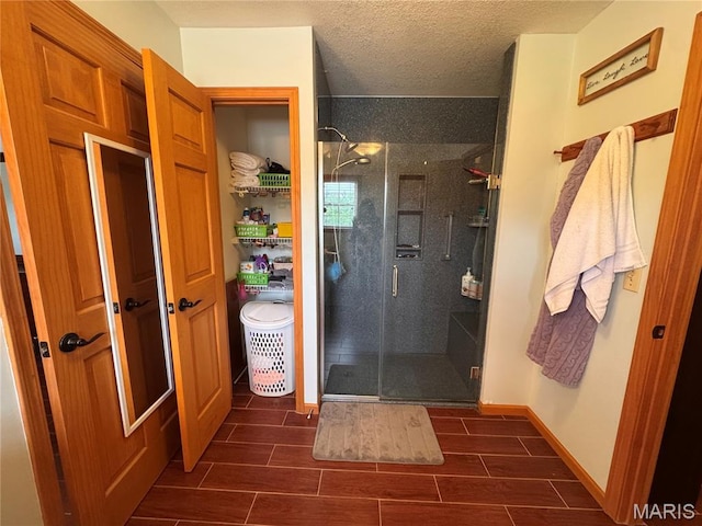 3581 Eagle Crest Dr, Palmyra, MO 63461 - full bathroom featuring a shower stall, wood finish floors, and a textured ceiling