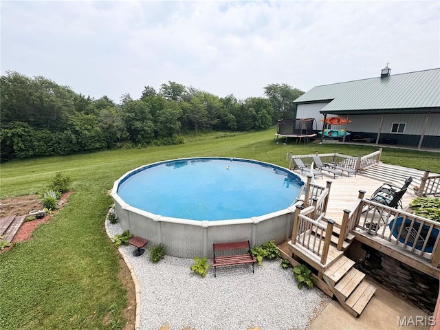 3581 Eagle Crest Dr, Palmyra, MO 63461 - view of pool featuring a trampoline, a yard, and a deck