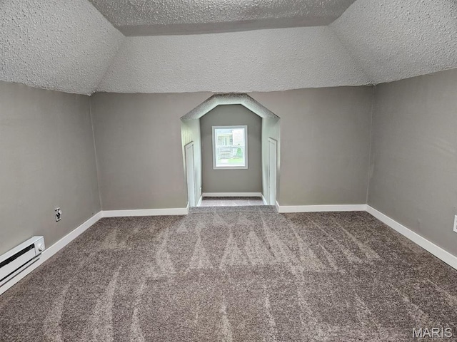 308 E Kathleen, Sikeston, MO 63801 - bonus room with a baseboard radiator, a textured ceiling, carpet floors, baseboards, and lofted ceiling