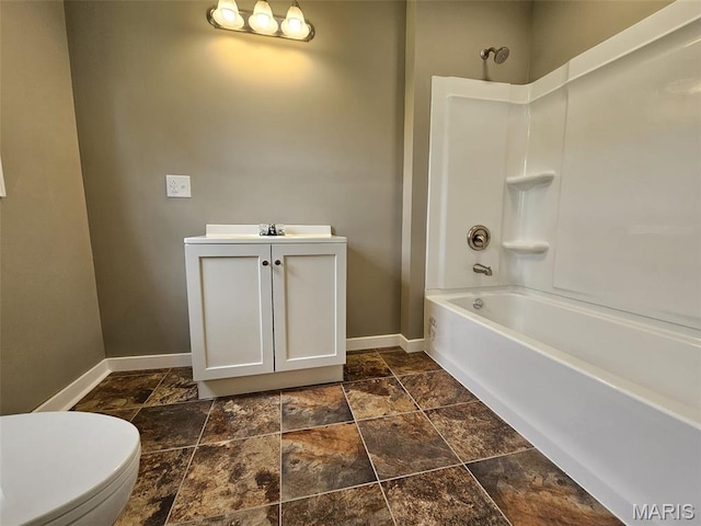 308 E Kathleen, Sikeston, MO 63801 - full bath featuring baseboards, stone tile flooring, vanity, toilet, and shower / washtub combination