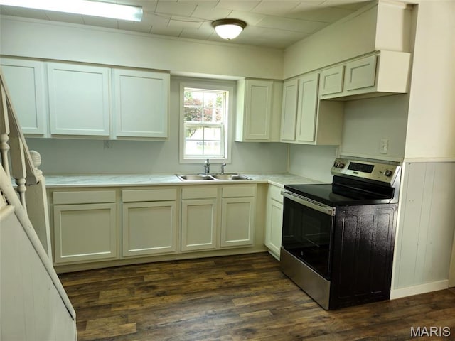 308 E Kathleen, Sikeston, MO 63801 - kitchen featuring electric range, a sink, dark wood-style flooring, and light countertops