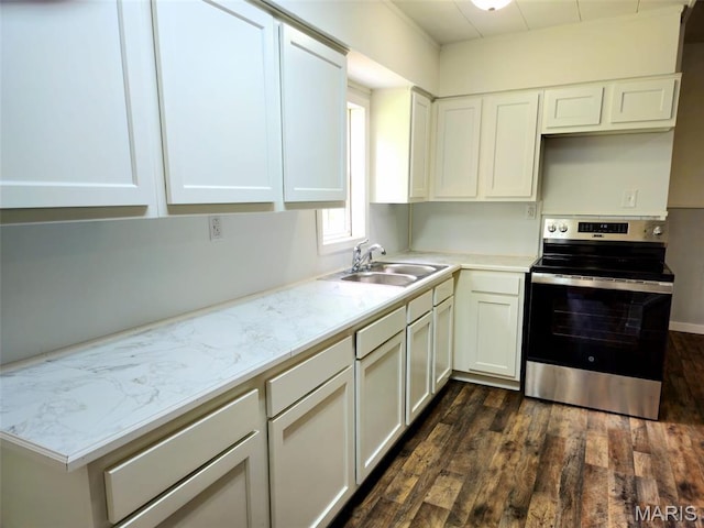 308 E Kathleen, Sikeston, MO 63801 - kitchen with electric stove, a sink, dark wood-style floors, and white cabinetry