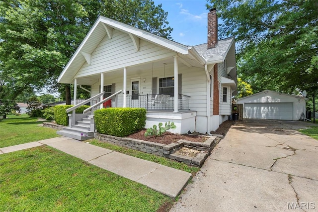 618 Parkview St, Jackson, MO 63755 - bungalow with covered porch, a garage, an outbuilding, a chimney, and a front yard