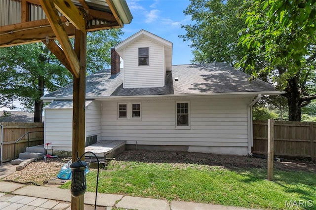 618 Parkview St, Jackson, MO 63755 - rear view of property featuring a shingled roof, a chimney, and a patio
