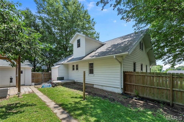 618 Parkview St, Jackson, MO 63755 - back of property featuring a shingled roof and a patio