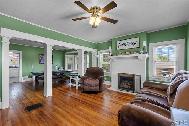 618 Parkview St, Jackson, MO 63755 - living area with ornate columns, plenty of natural light, crown molding, ceiling fan, and a fireplace