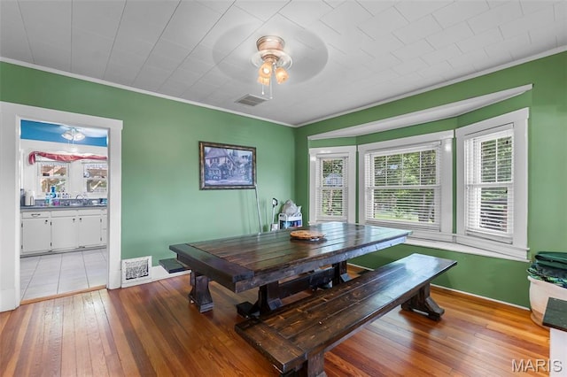 618 Parkview St, Jackson, MO 63755 - dining room with crown molding, ceiling fan, and light wood-style flooring