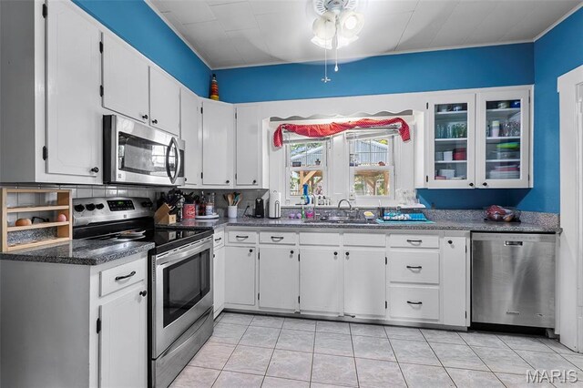 618 Parkview St, Jackson, MO 63755 - kitchen with appliances with stainless steel finishes, a sink, white cabinets, ceiling fan, and glass insert cabinets