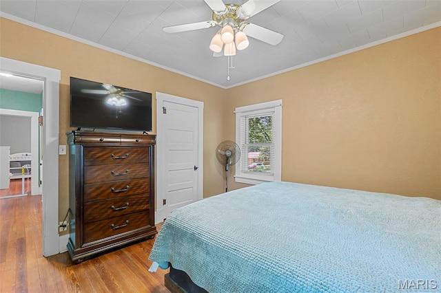 618 Parkview St, Jackson, MO 63755 - bedroom with hardwood / wood-style flooring, crown molding, and ceiling fan