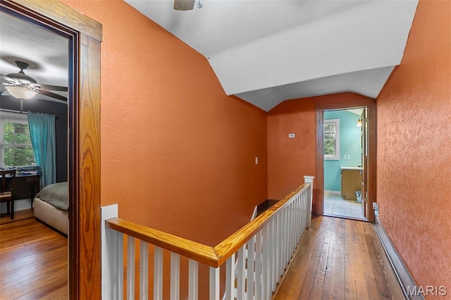 618 Parkview St, Jackson, MO 63755 - hallway featuring an upstairs landing, hardwood / wood-style flooring, lofted ceiling, a textured wall, and baseboards
