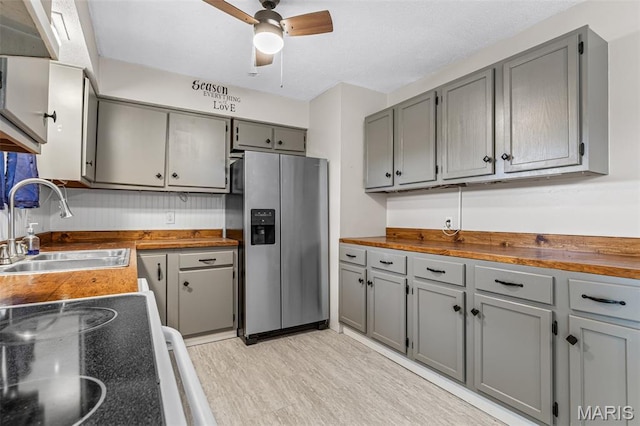 1 Mileva Ct, Farmington, MO 63640 - kitchen featuring stainless steel fridge with ice dispenser, gray cabinetry, a sink, ceiling fan, and range