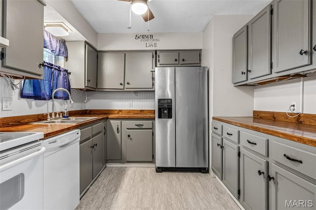 1 Mileva Ct, Farmington, MO 63640 - kitchen featuring white appliances, butcher block countertops, gray cabinets, a sink, and light wood-type flooring