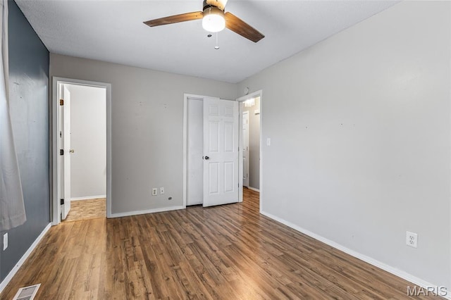 1 Mileva Ct, Farmington, MO 63640 - unfurnished bedroom with wood finished floors, baseboards, and ceiling fan
