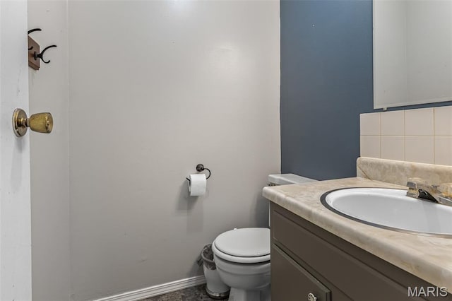 1 Mileva Ct, Farmington, MO 63640 - bathroom with vanity, toilet, backsplash, and baseboards