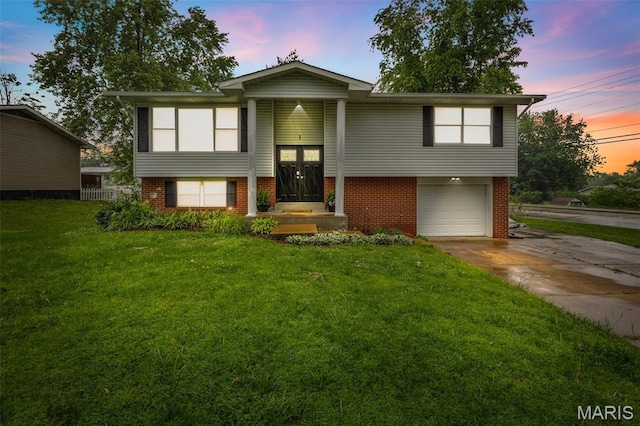 1 Mileva Ct, Farmington, MO 63640 - split foyer home with brick siding, an attached garage, a lawn, and driveway