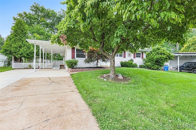 1385 Mallard Ln, Florissant, MO 63031 - view of property hidden behind natural elements featuring concrete driveway and an attached carport