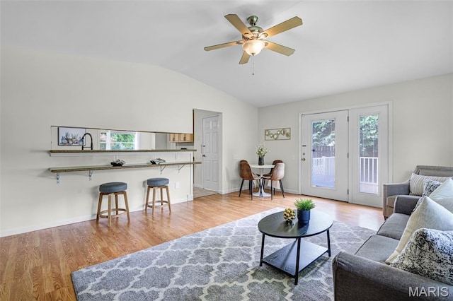 1385 Mallard Ln, Florissant, MO 63031 - living room featuring vaulted ceiling, ceiling fan, and wood finished floors
