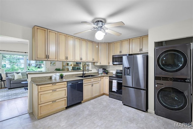 1385 Mallard Ln, Florissant, MO 63031 - kitchen with stainless steel appliances, stacked washer / drying machine, and light brown cabinets