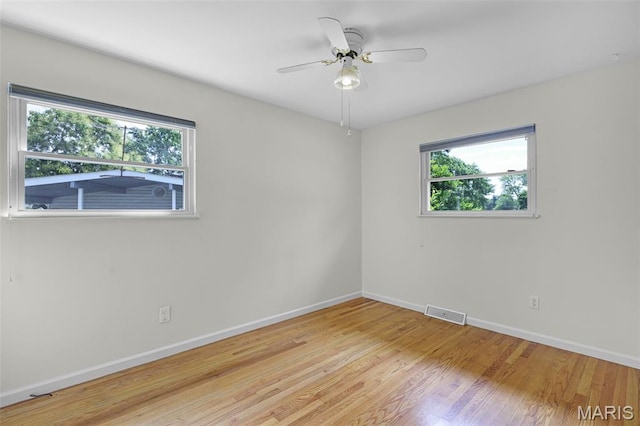 1385 Mallard Ln, Florissant, MO 63031 - unfurnished room with light wood finished floors and ceiling fan
