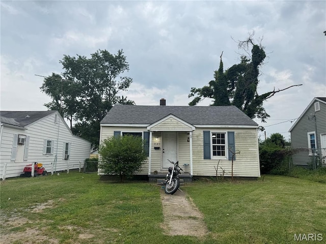 321 Benton St, Sikeston, MO 63801 - bungalow-style home featuring roof with shingles and a chimney