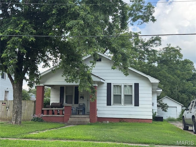 512 S New Madrid St, Sikeston, MO 63801 - bungalow-style house featuring a porch and a garage