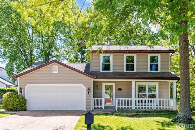 204 Oakwood Farms Ct, Ballwin, MO 63021 - traditional home with a garage, covered porch, concrete driveway, a front yard, and roof with shingles