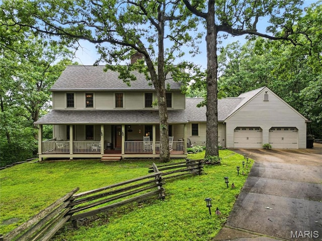 1423 Emily Ln, Festus, MO 63028 - view of front of house featuring covered porch, a chimney, driveway, a garage, and a front yard
