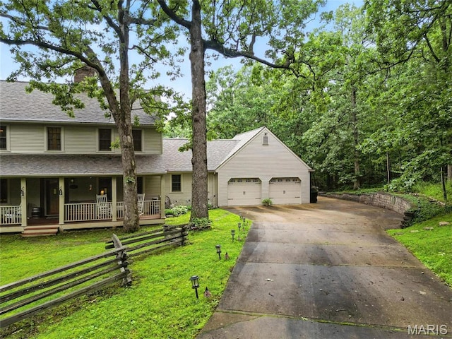 1423 Emily Ln, Festus, MO 63028 - view of front of house featuring a front yard, an attached garage, concrete driveway, a porch, and roof with shingles